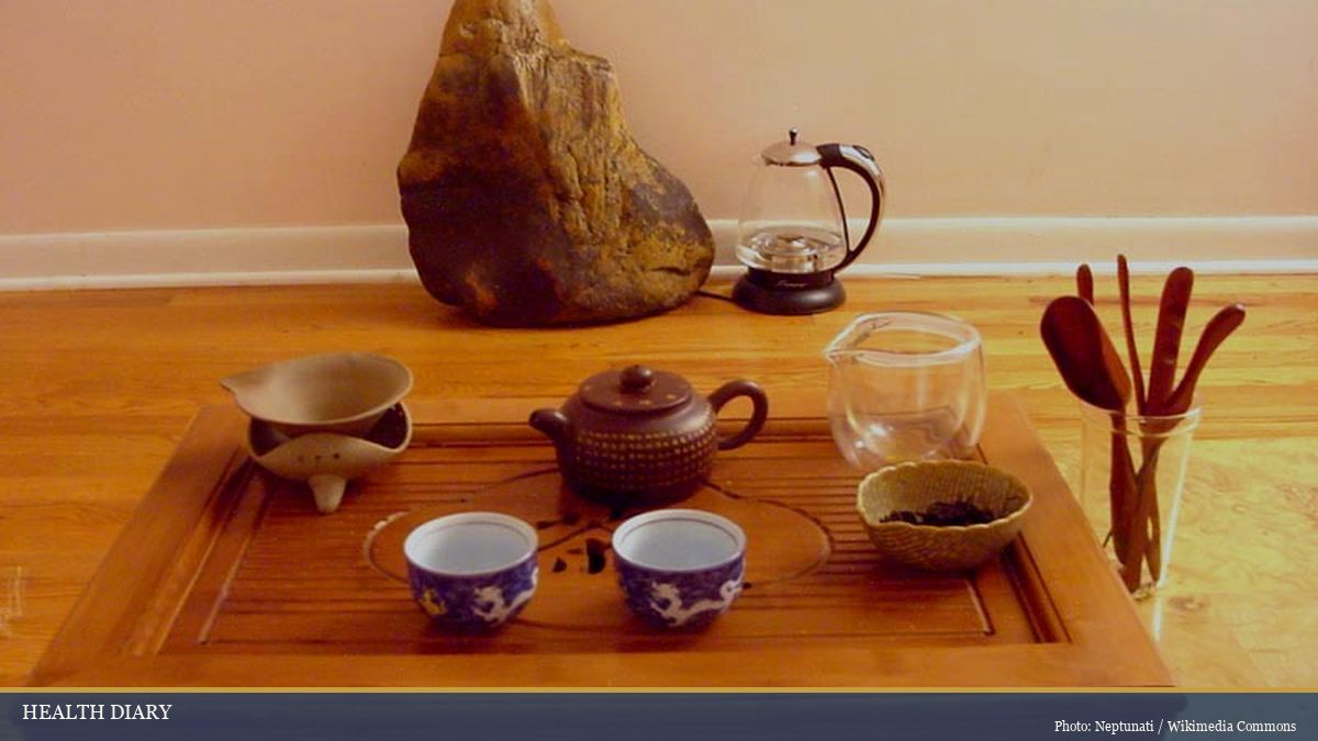 Chinese gongfu cha tea set with clay teapot small cups and tea tray