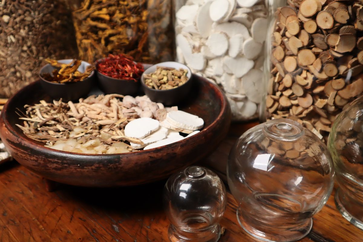 Dried tonic root slices in a bowl, used in codonopsis-style decoctions