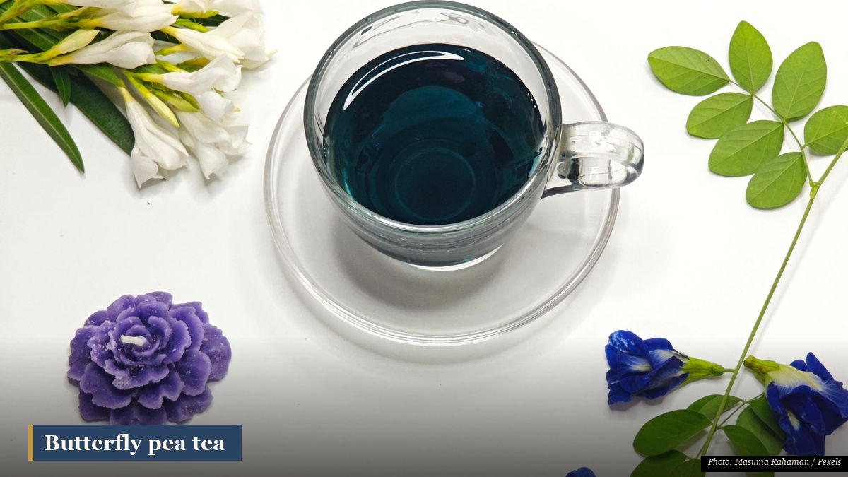 Bright blue butterfly pea flower tea in a clear glass, a cooling Southeast Asian herbal infusion