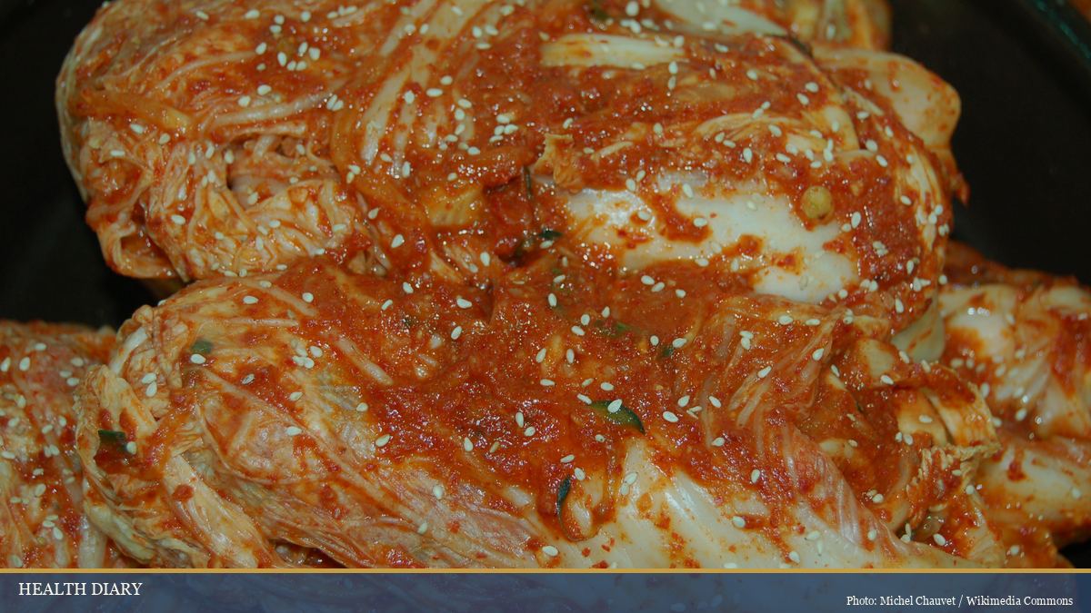 Freshly prepared napa cabbage kimchi seasoned with chili paste and sesame seeds