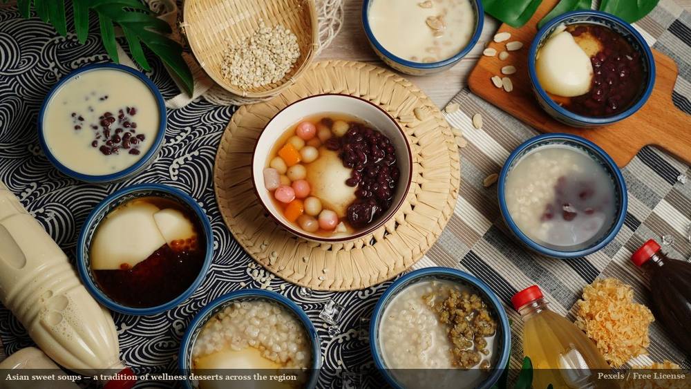 Asian sweet soups in ceramic bowls arranged as flat lay, including white fungus and taro ball varieties