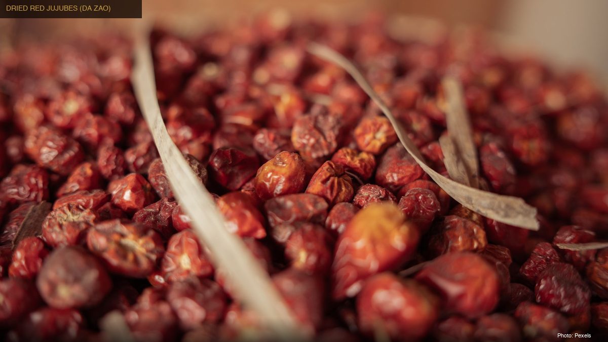 Close-up of dried red jujube dates, key ingredient in traditional Chinese tonic soup