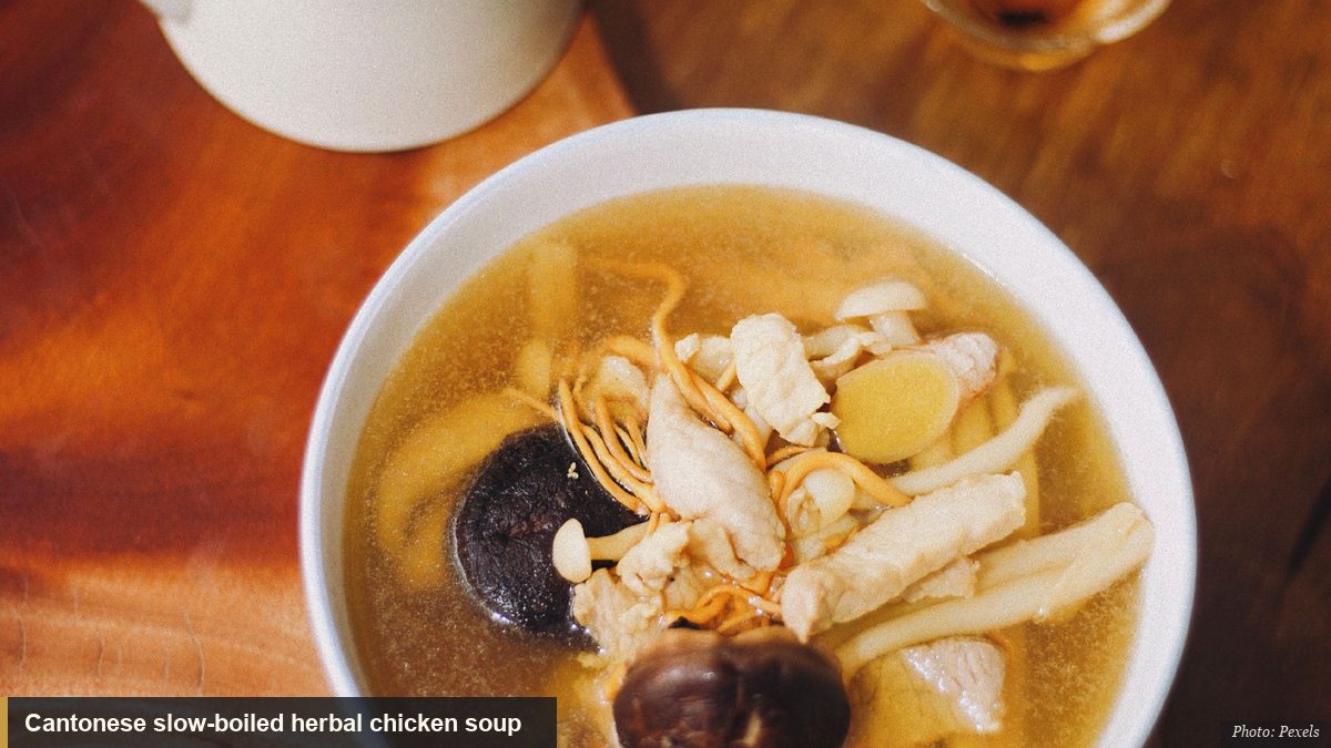 Cantonese slow-boiled herbal chicken soup in a white bowl with a teapot