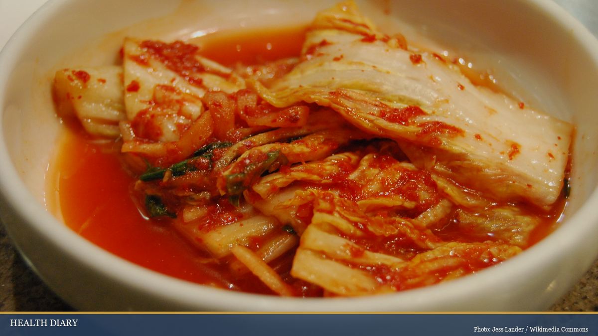 Bowl of traditional Korean kimchi with napa cabbage in seasoned brine