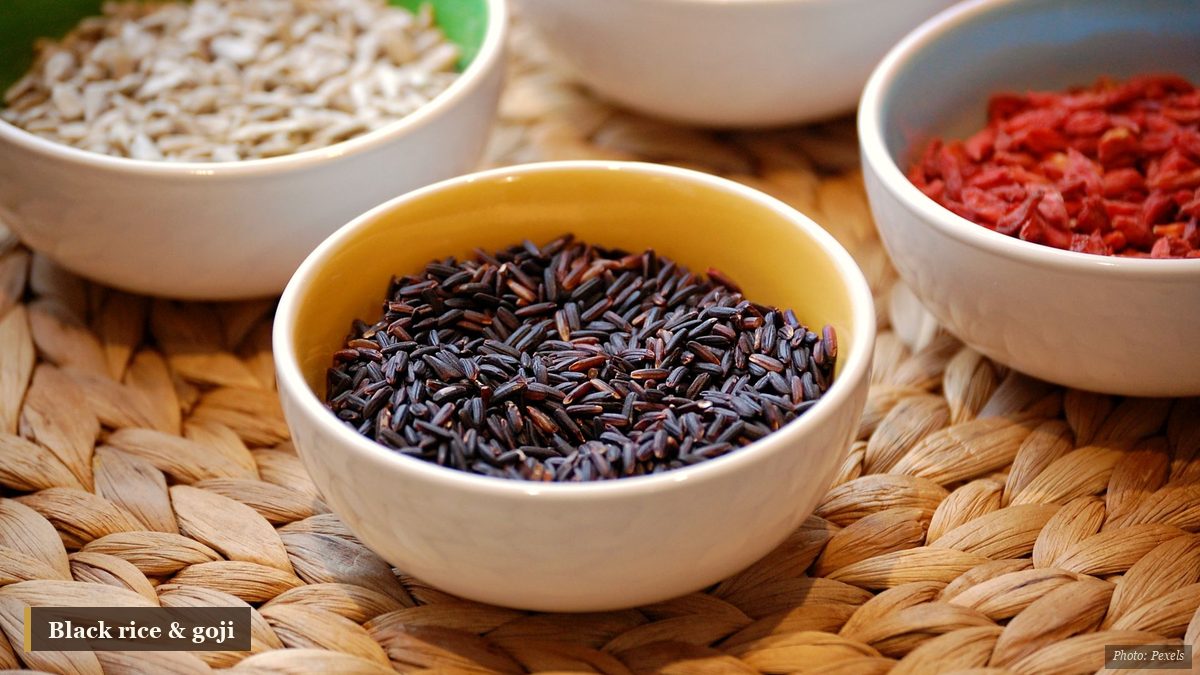 Bowl of black rice with goji berries and seeds for winter nourishment