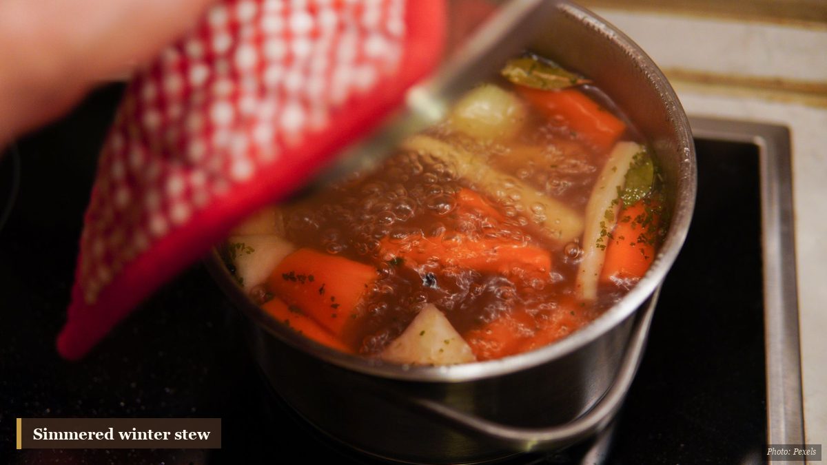 Simmering pot of winter root-vegetable stew cooking on the stove